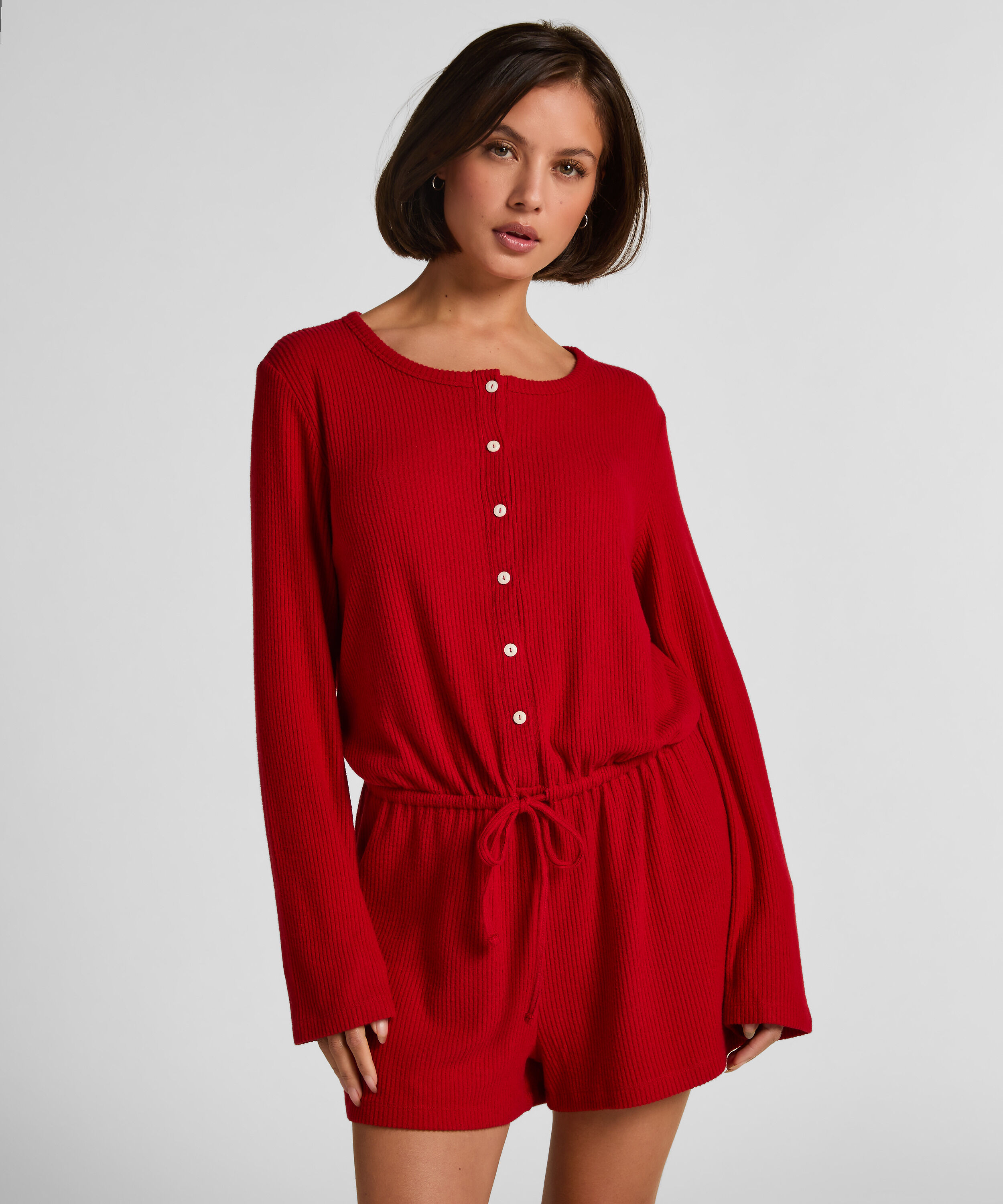 Kort ribbstickad Onesie