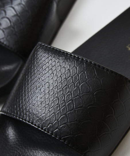 Tofflor med ormmönster, Svart